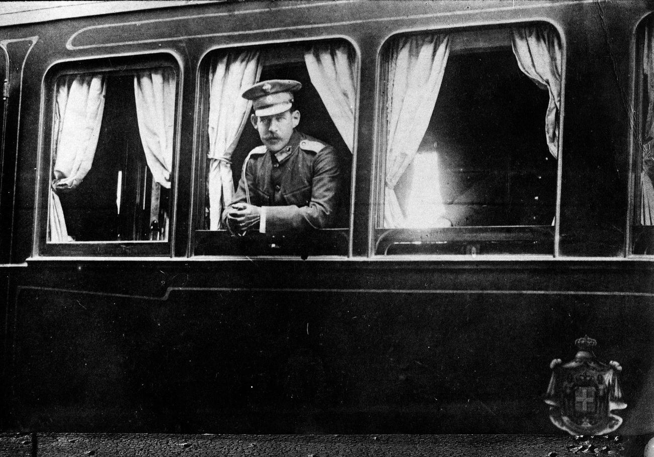 #7 Constantine I ;eaving Athen by train, watching out of the lounge car, 1910