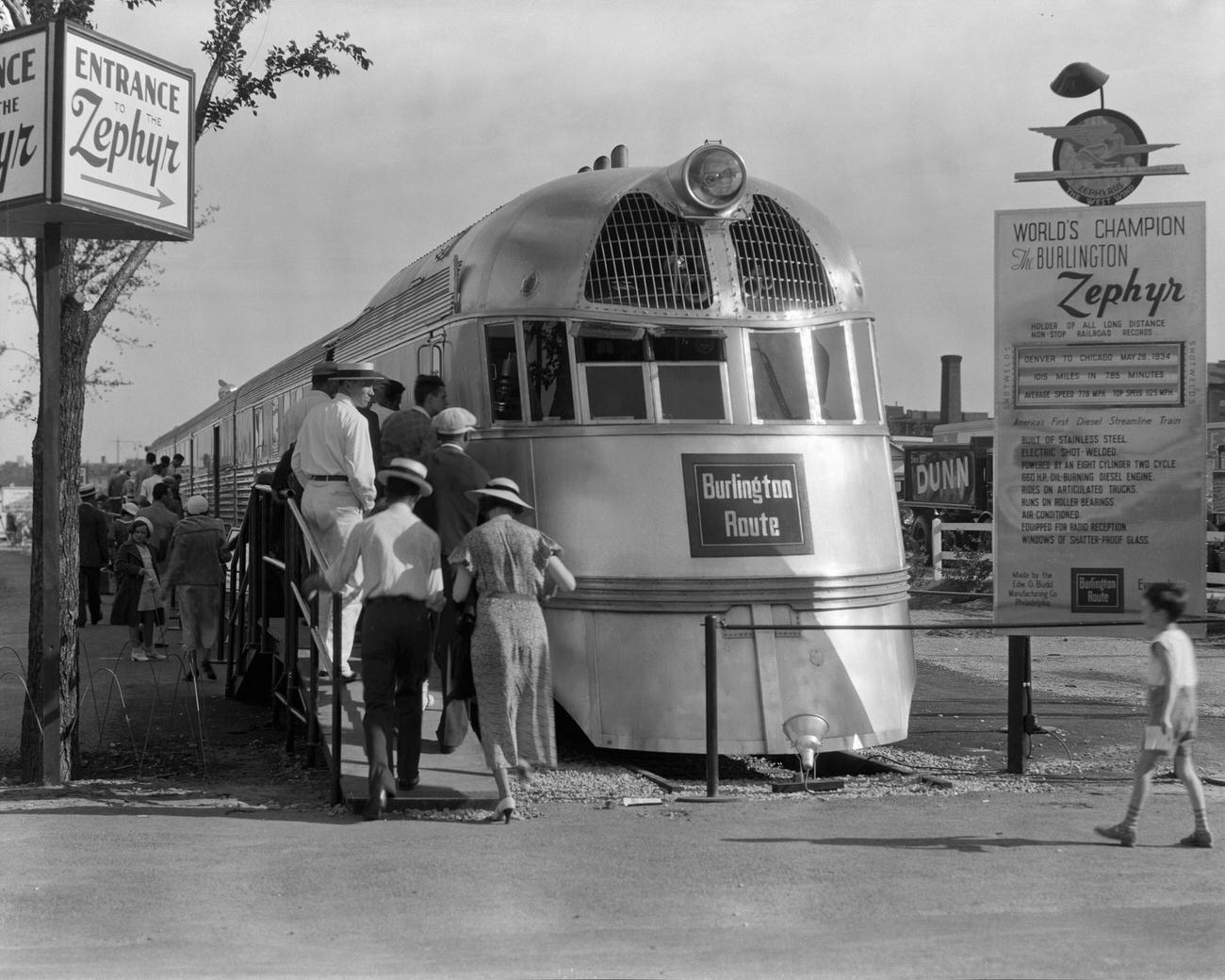 View of people as they line up to view the Burlington Zephyr (which was later renamed the Pioneer Zephyr) at the Century of Progress International Exposition (or the Chicago World’s Fair) Chicago, Illinois, 1934.
