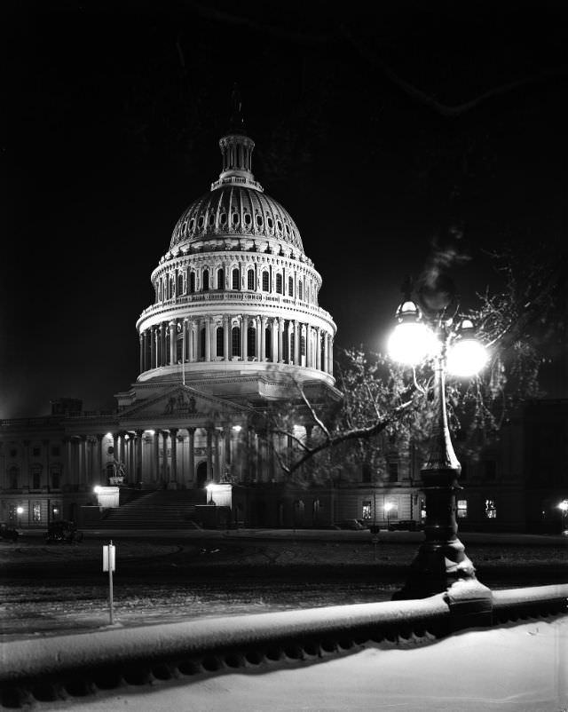 #22 East front of U.S. Capitol at night in winter, 1940