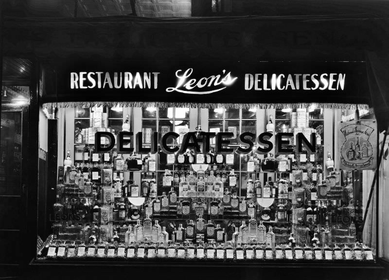 #8 Window display of whiskey at Leon’s Delicatessen, 1930s
