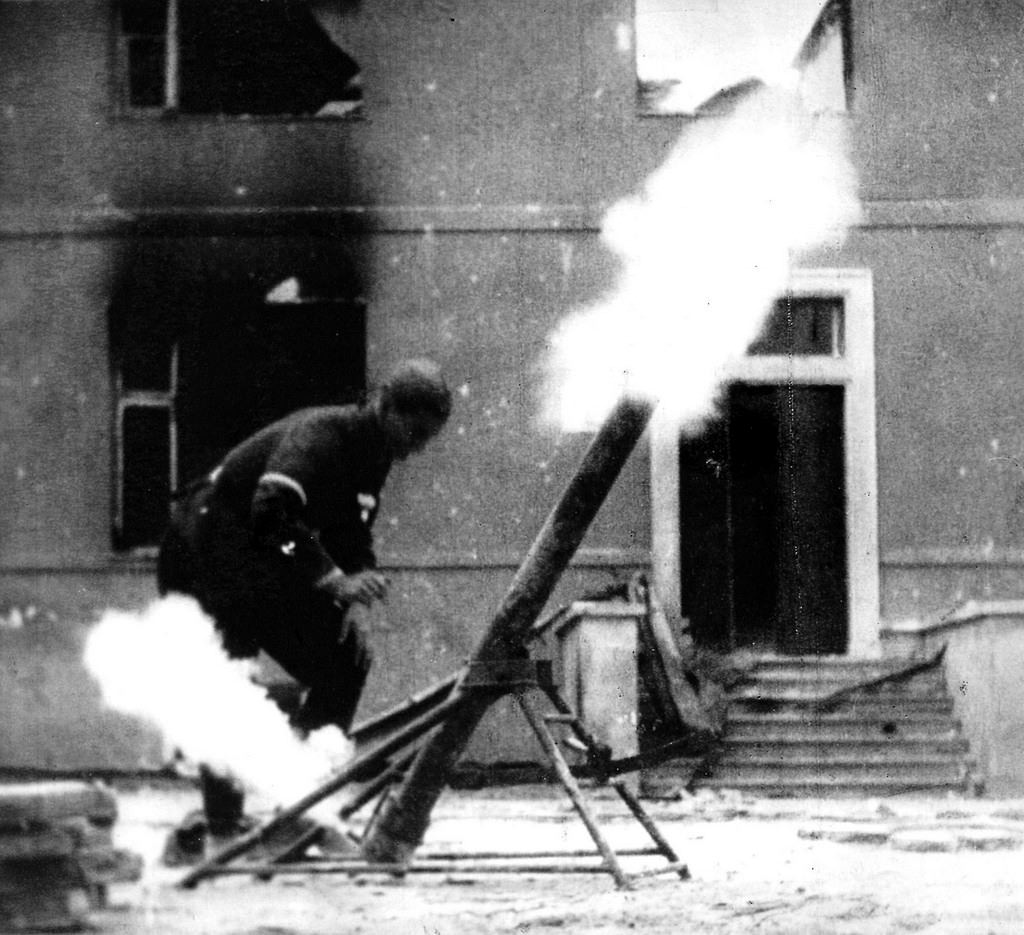 #29 Man firing at German positions from Piusa XI Street using a grenade launcher.