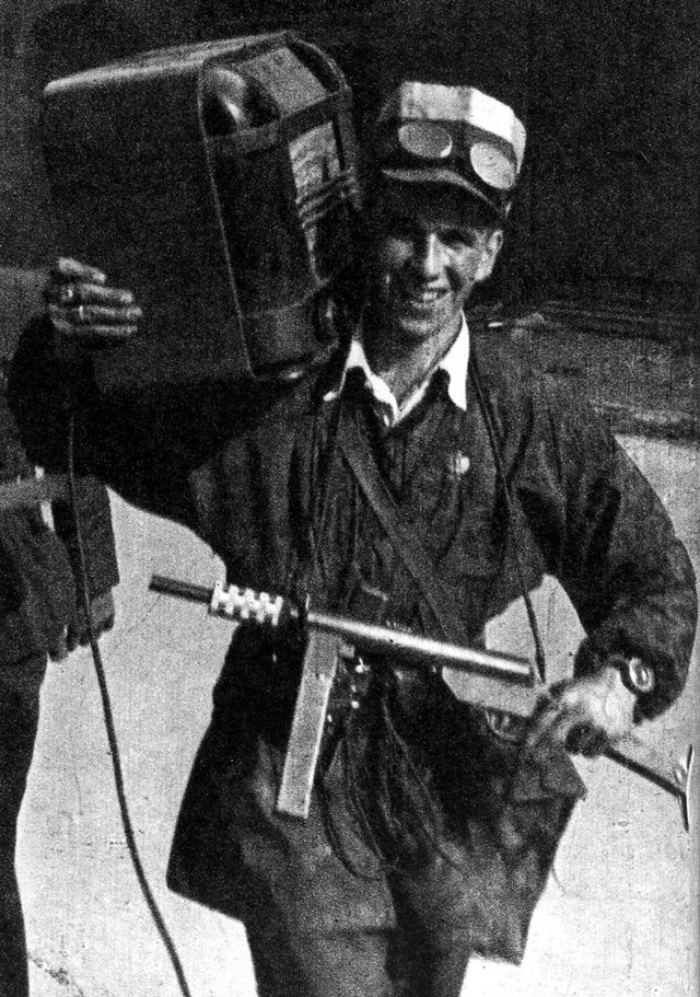 #3 A Polish partisan carrying a Błyskawica submachine gun and a radio.