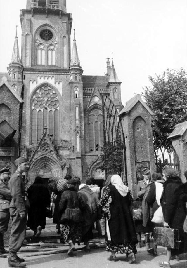 #43 Residents of the Wola district being herded into a local church (św Wojciecha) prior to being evacuated from Warsaw.