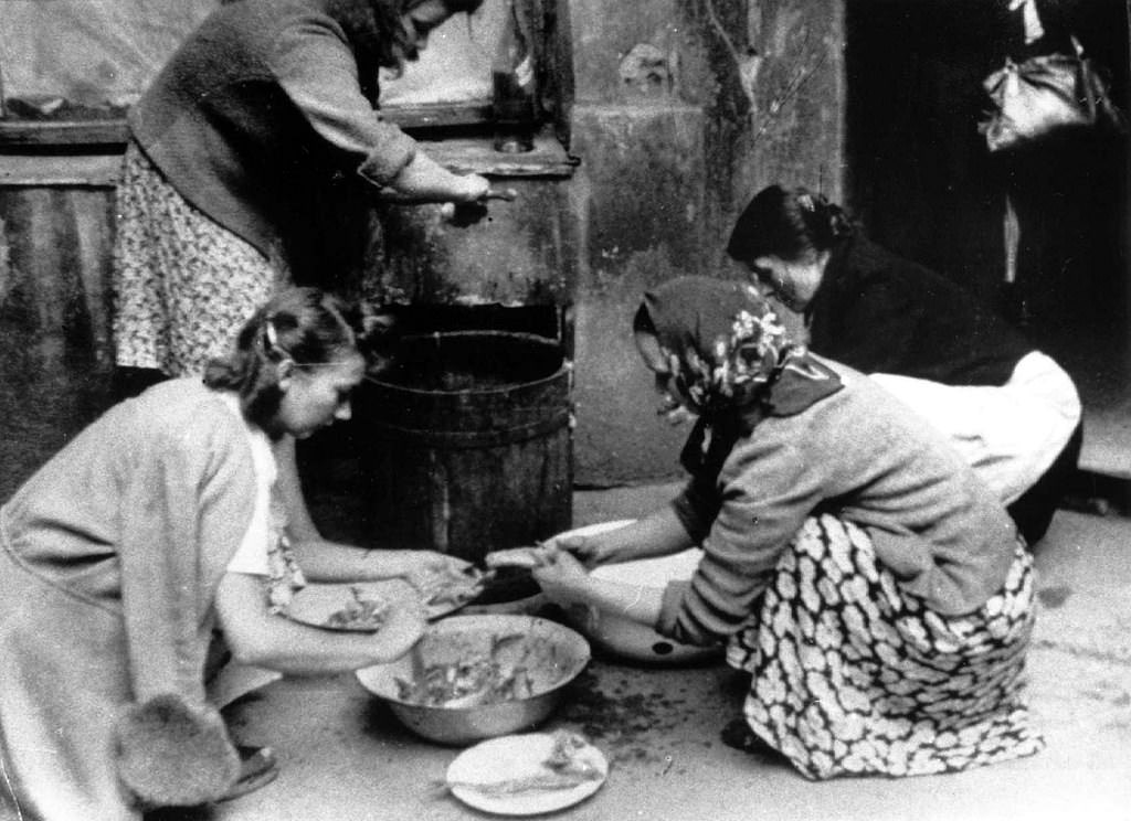 #49 Women preparing food.