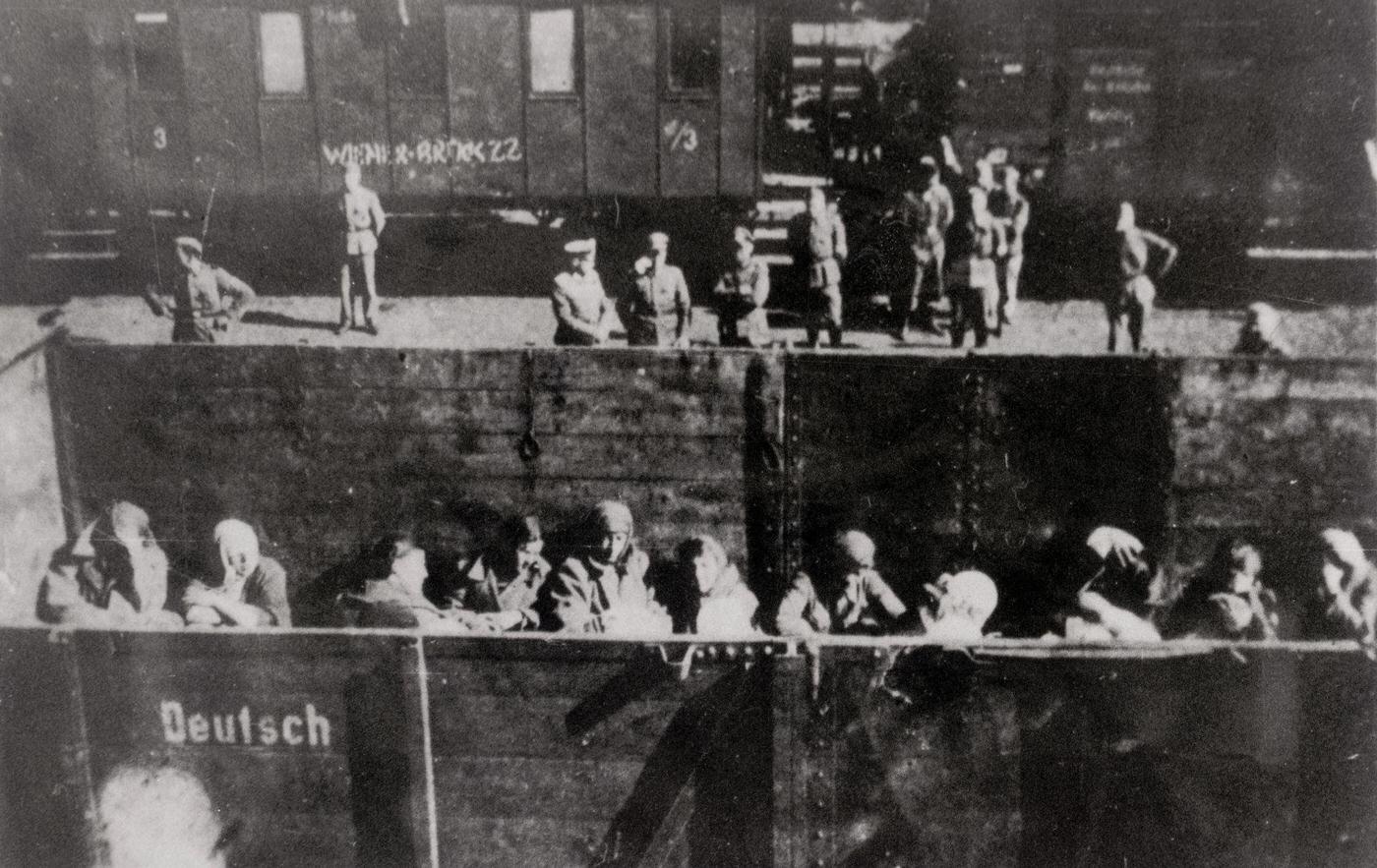 #72 Deportation of Polish Jews in open cattle carriages at the “reloading point” in Warsaw, on the platform German soldiers in Poland, 1944