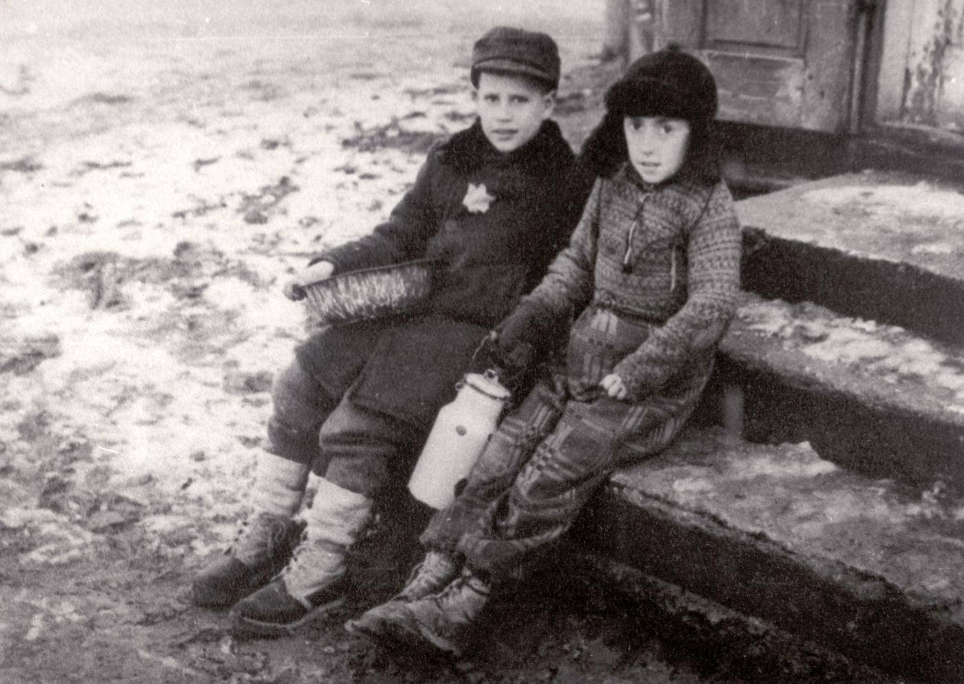 #73 Two children in the snow covered Ghetto of Warsaw, 1944