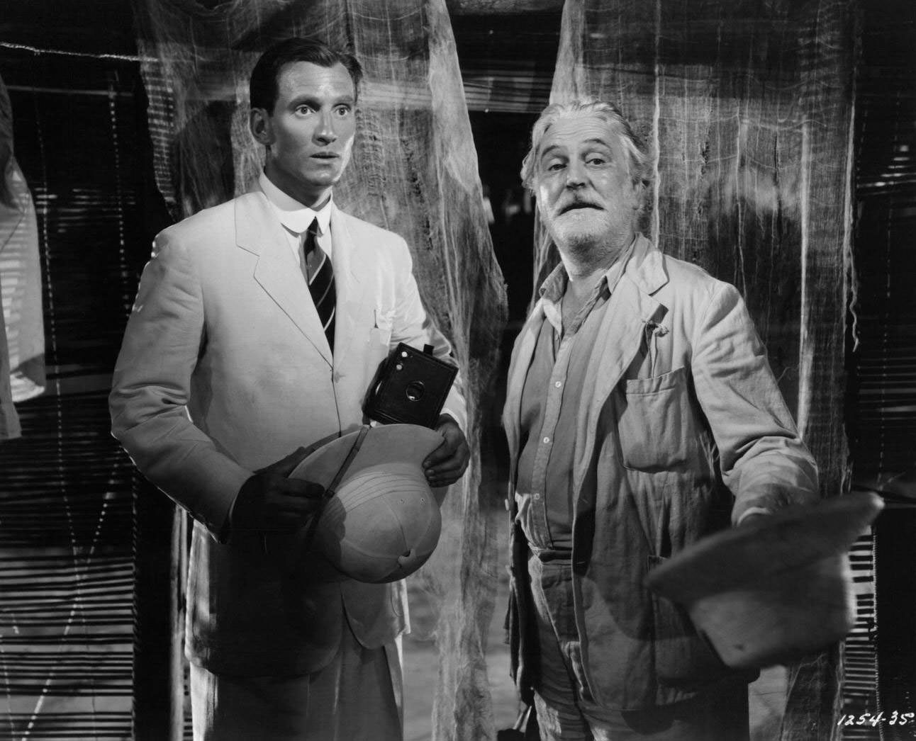 Richard Ainley is shocked as Frank Morgan presents Africa to him in a scene from the film ‘White Cargo’, 1942.