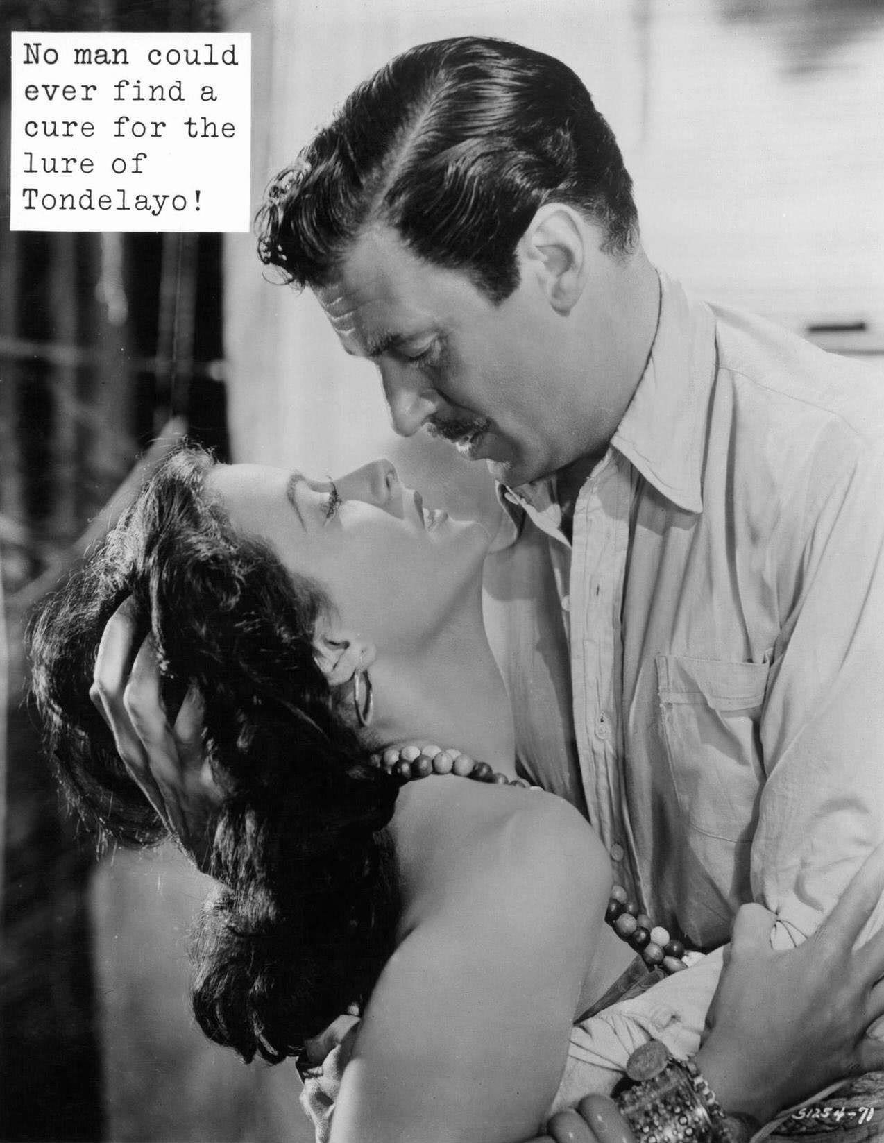Hedy Lamarr and Walter Pidgeon look into one an others eyes with passion as they embrace in a scene from the film ‘White Cargo’, 1942.