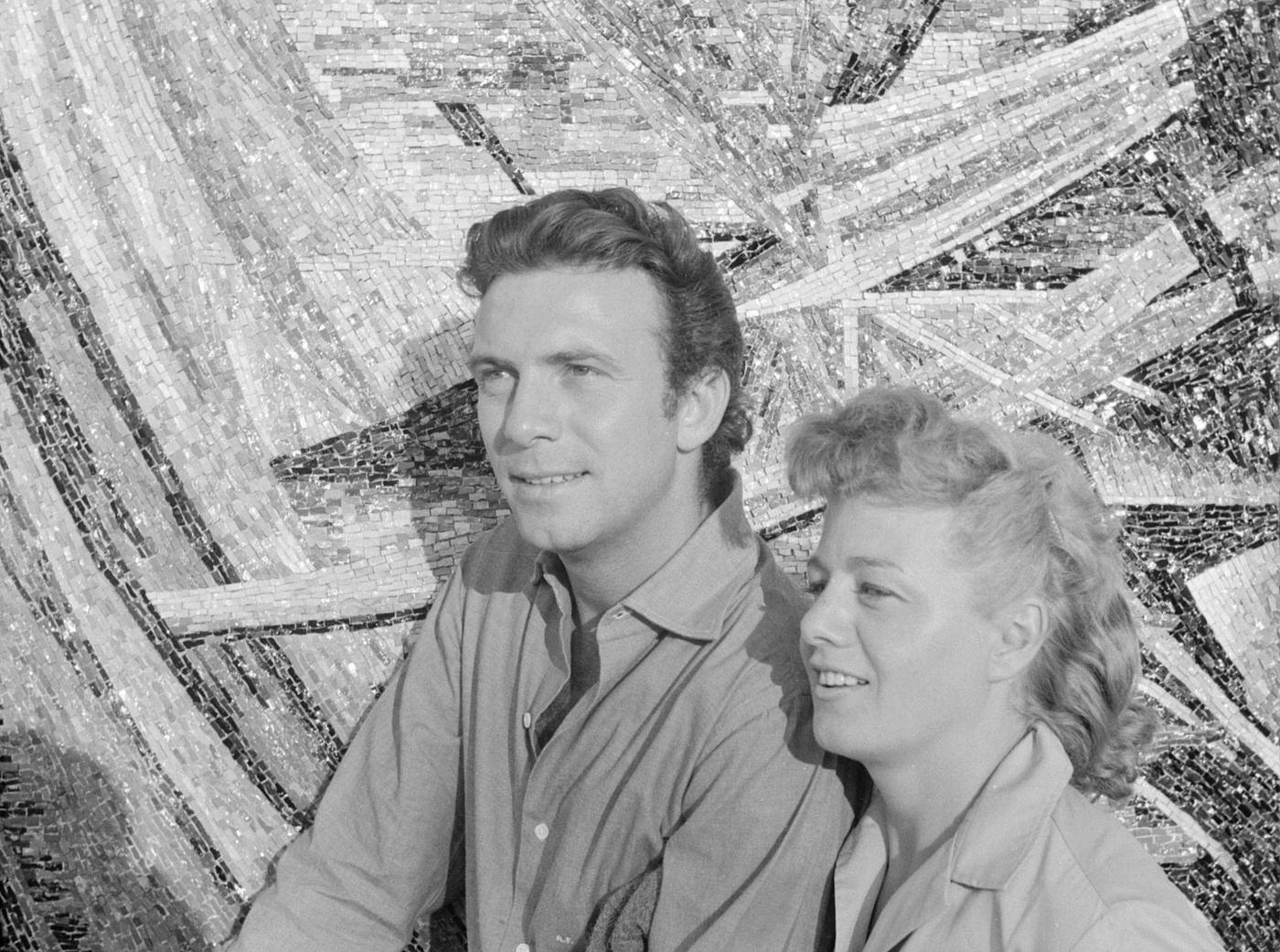 #47 Shelley Winters (Shirley Schrift) and her husband and American actor Anthony Franciosa (Anthony George Papaleo, Jr.) beside a mosaic during the 19th Venice International Film Festival. Venice, August 1958