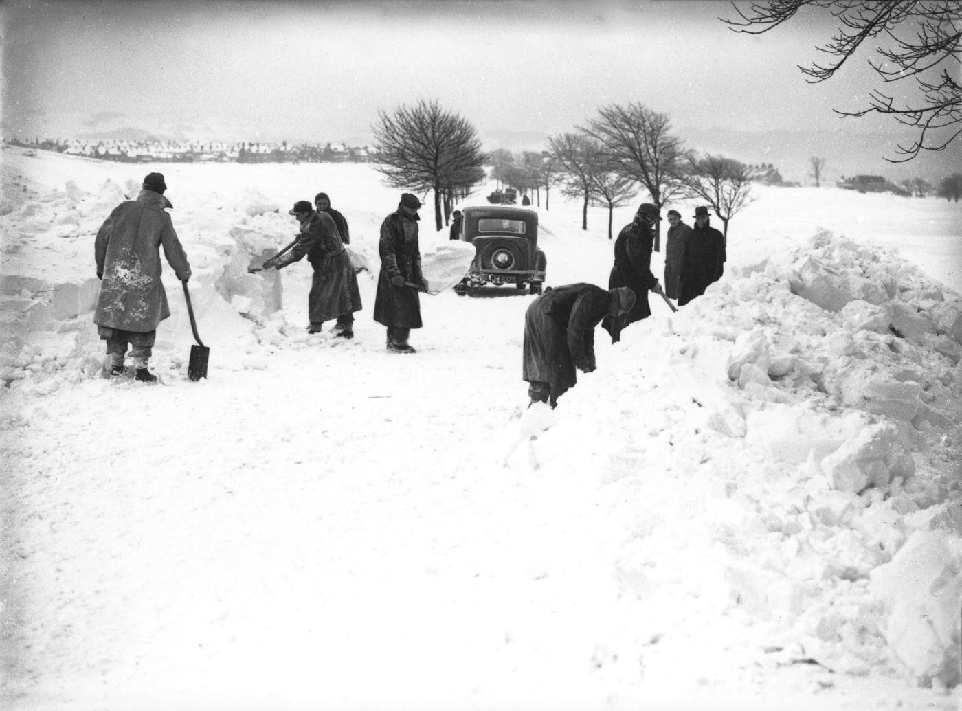 #51 German/Italian prisoners of war clearing snow on Fairfield Common, Buxton, Derbyshire, 1947.