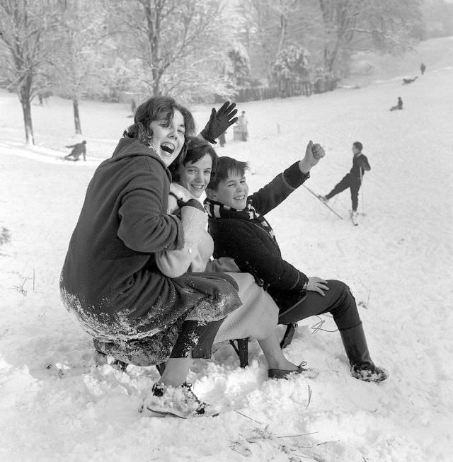 #26 Children wave to the Mirror photographer before descending Hampstead Heath on New Year’s Day, 1962.
