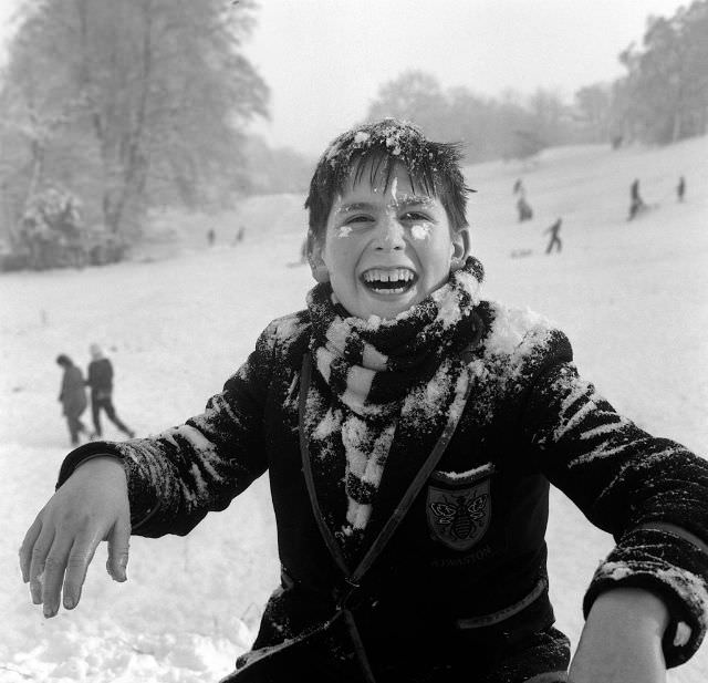 #28 Little boy playing in the snow on Hampstead Heath, 1962.