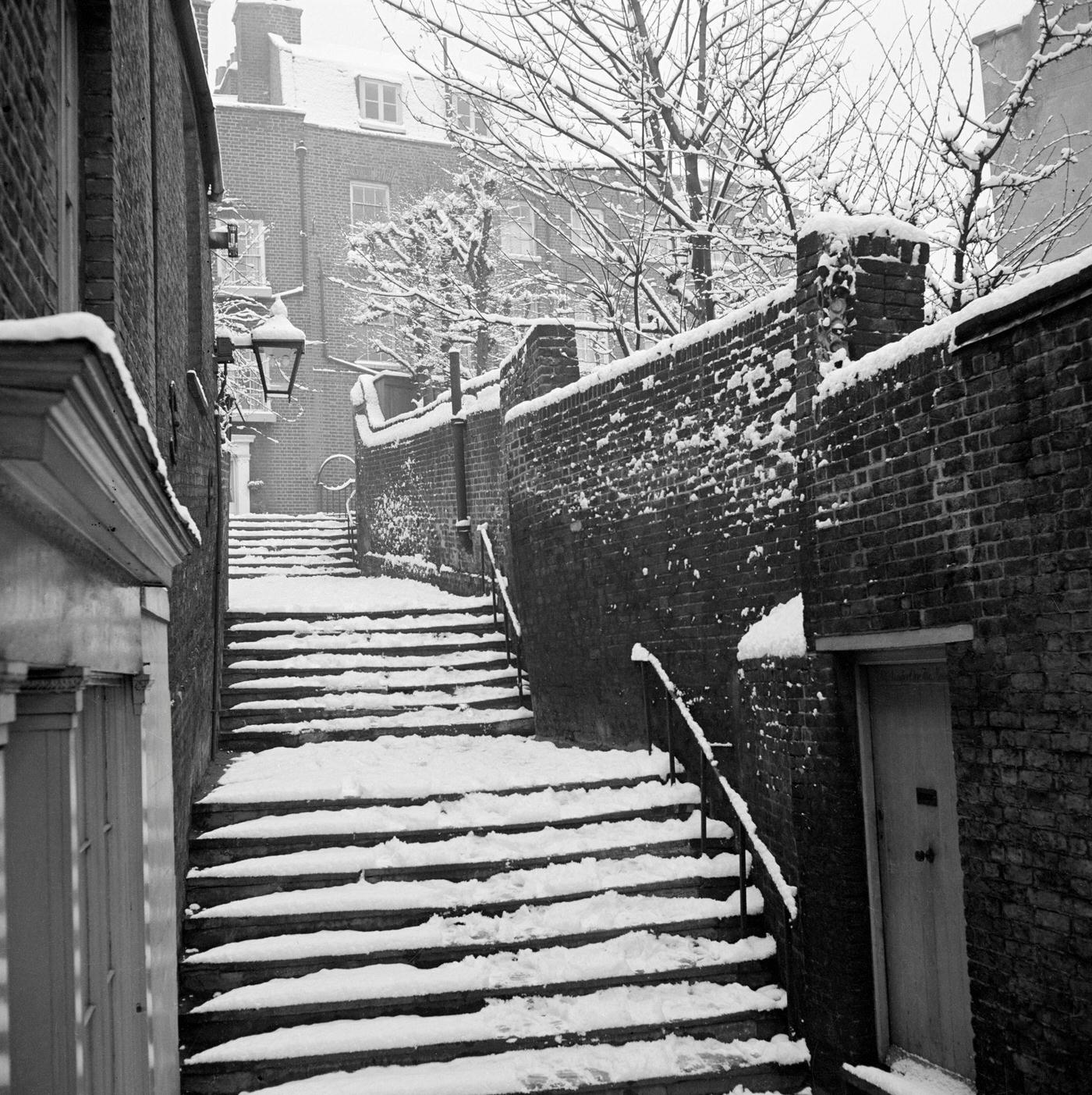 #6 Three flights of steps in the snow, part of the narrow passage running between Heath Street and Hampstead Grove.