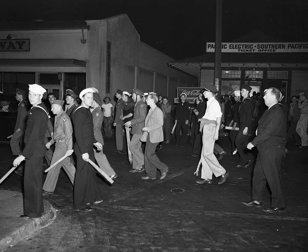 #17 Armed with clubs, pipes and bottles, this self-appointed posse of uniformed men looked for zoot suit youths when the Navy Shore Patrol stepped in and broke it up on June 11, 1943
