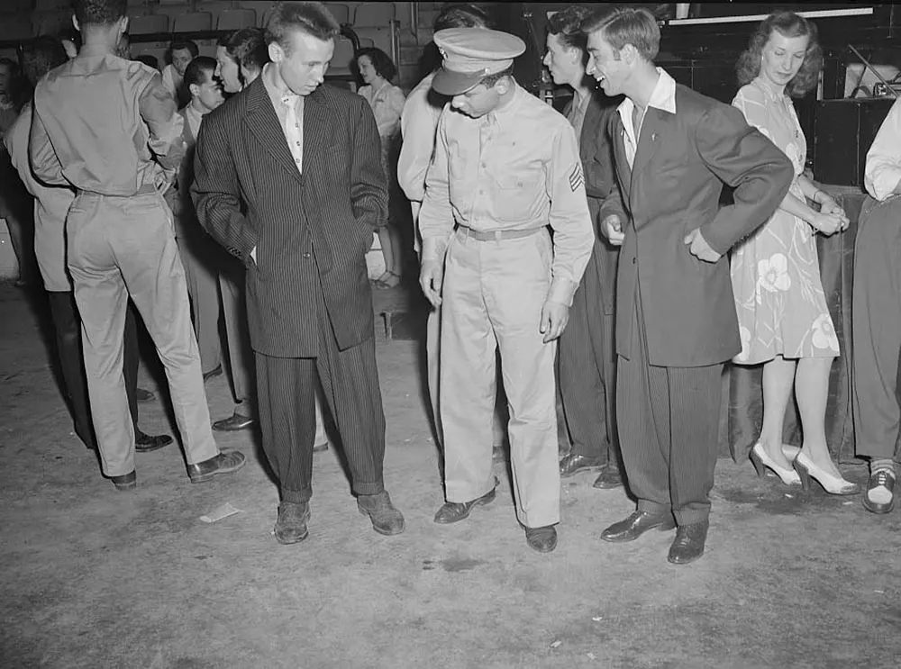 #3 A soldier with two men wearing zoot suits in Washington, D.C., 1942