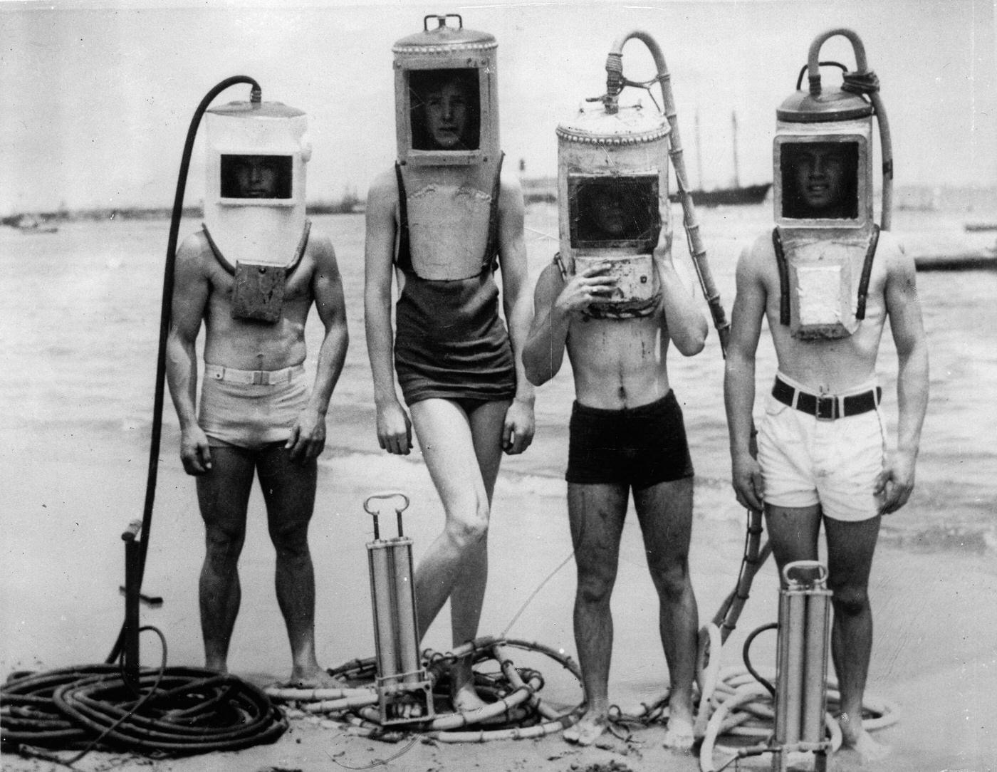 #106 A group of boys made diving helmets from sections of hot water heaters, boilers and other easily secured “junk”. Los Angeles. USA – June 23, 1933.