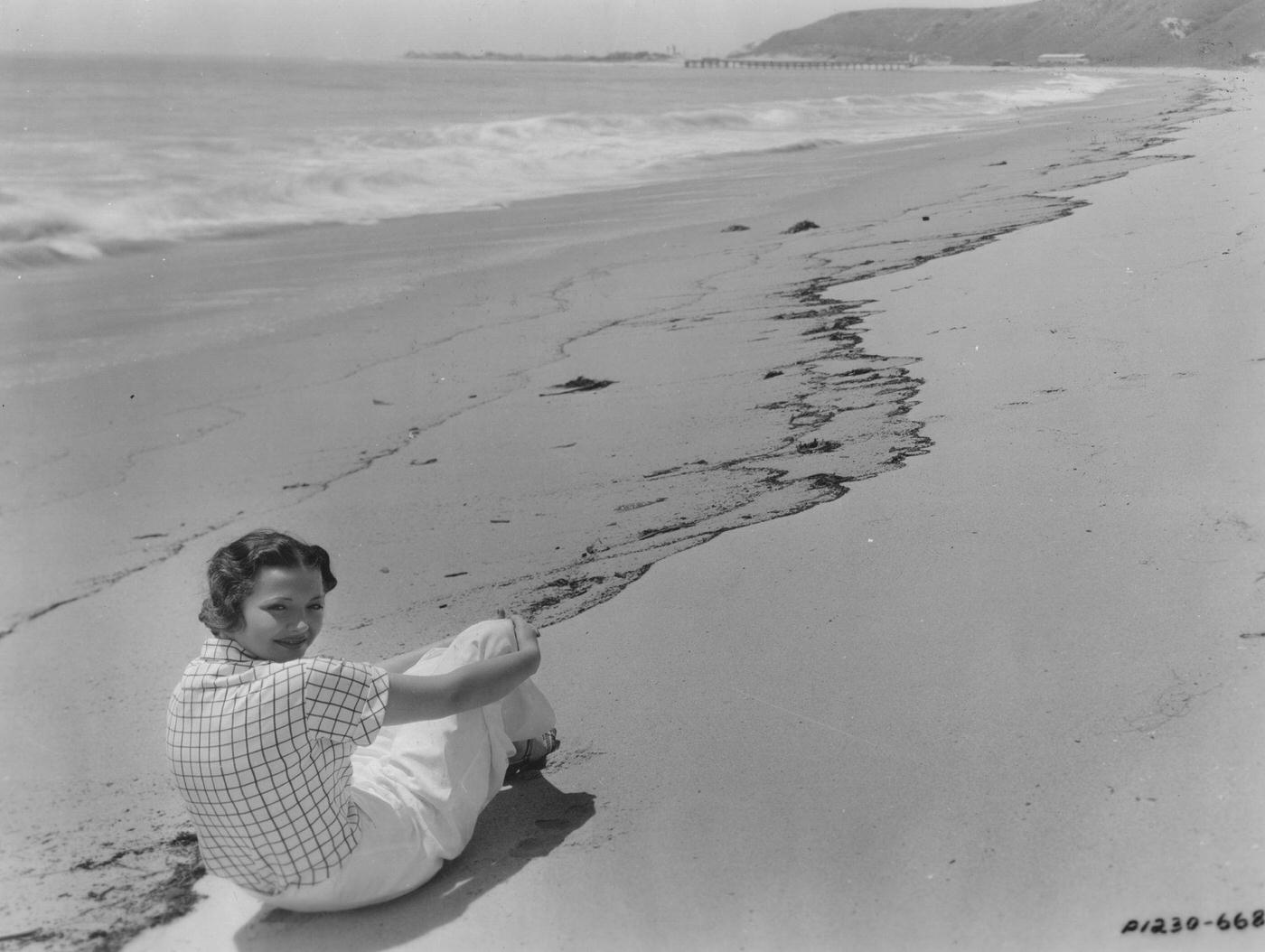 #110 Sylvia Sidney (1910 – 1999) the American film and television actress on the beach in front of her Malibu home where she spends her time when she is not working
