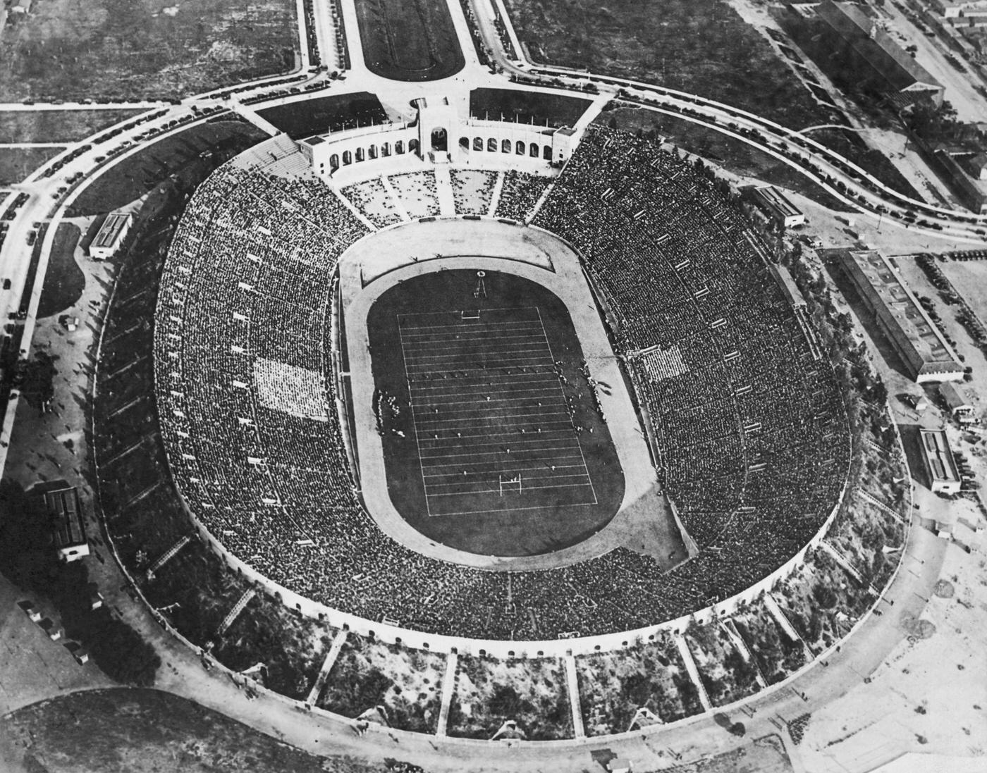 #9 Crowds watching an American football match at the Los Angeles Memorial Coliseum, 1930.