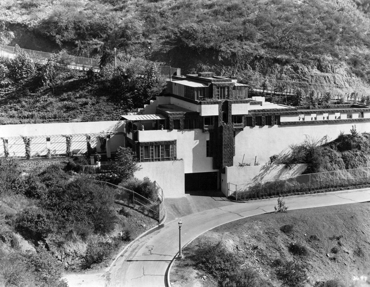 #121 An exterior view of the home of Ramon Novarro, the Metro Goldwyn Mayer star, designed by Ramon Novarro himself, situated in the hills overlooking Los Angeles, 1930.