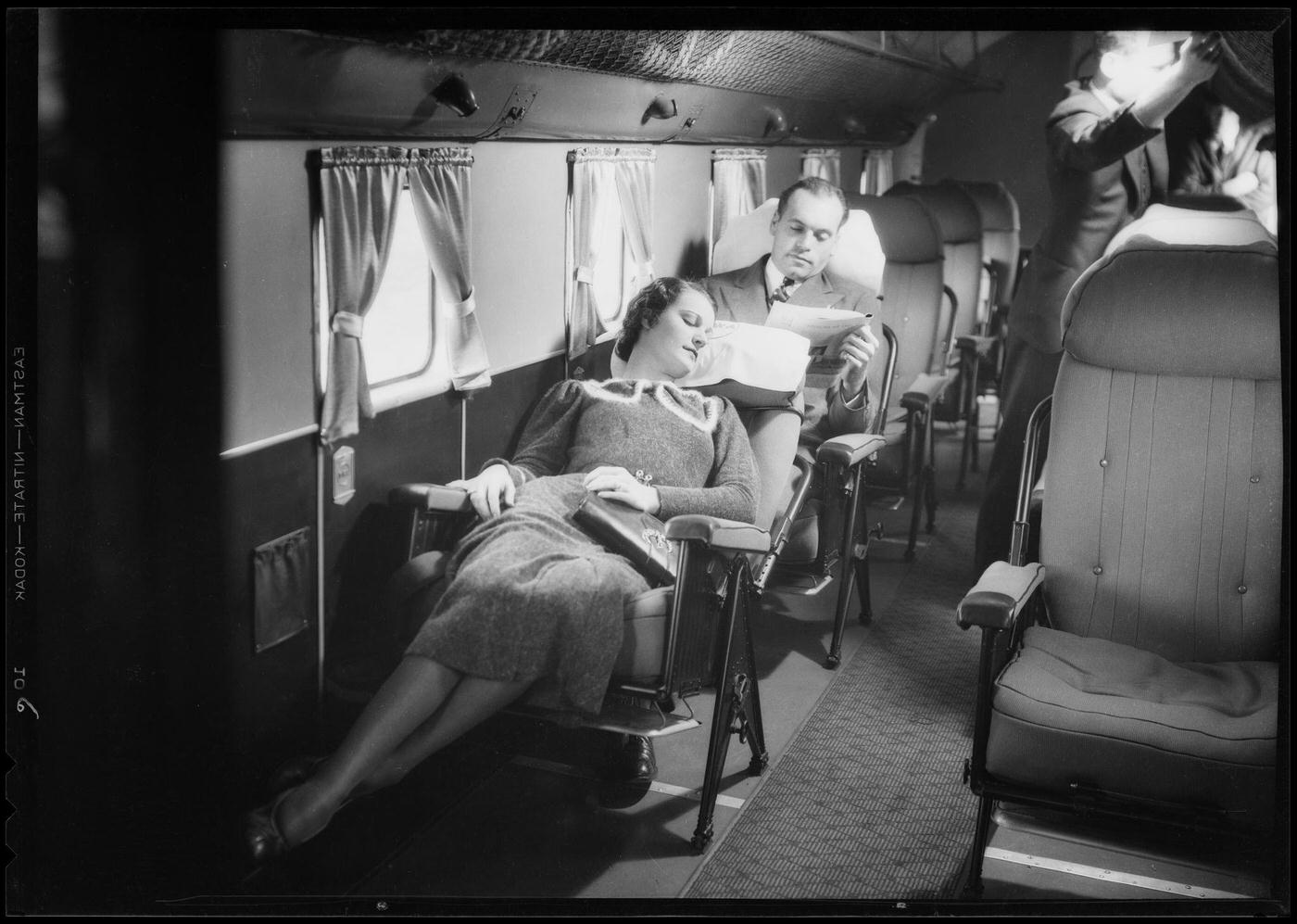 A customer reclines in the cabin of a Transcontinental &; Western Air Douglas DC-1 Airplane.