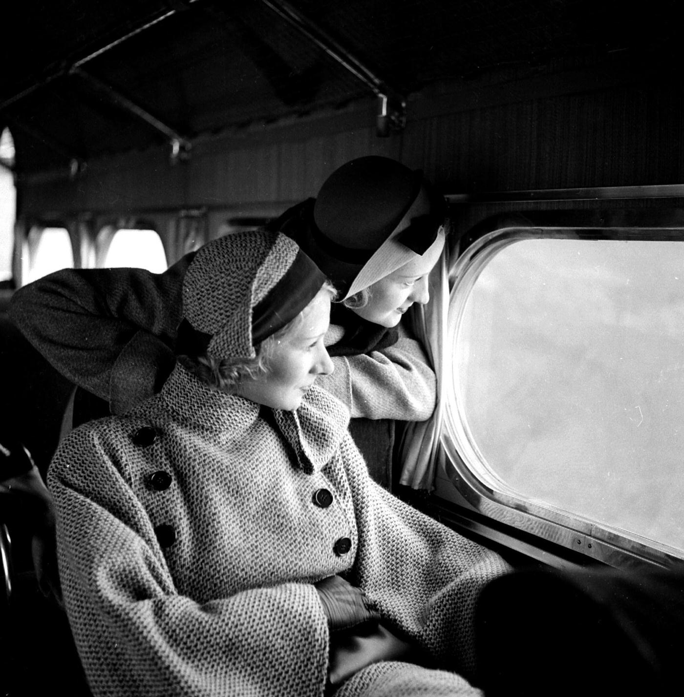 #33 Women aboard an airplane between Paris and London, 1934