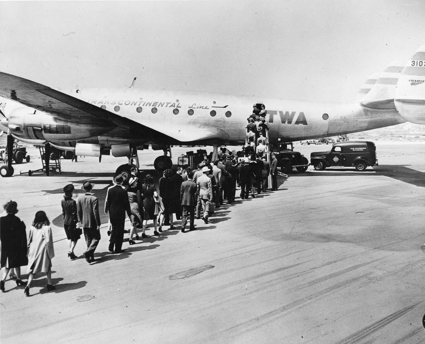 Passengers are boarding a Lockheed ‘Constellation’ on the tarmac at an unidentified airport in 1946. The plane could accommodate 57 passengers and a crew of seven and fly coast-to-coast in 6 hours, 58 minutes.