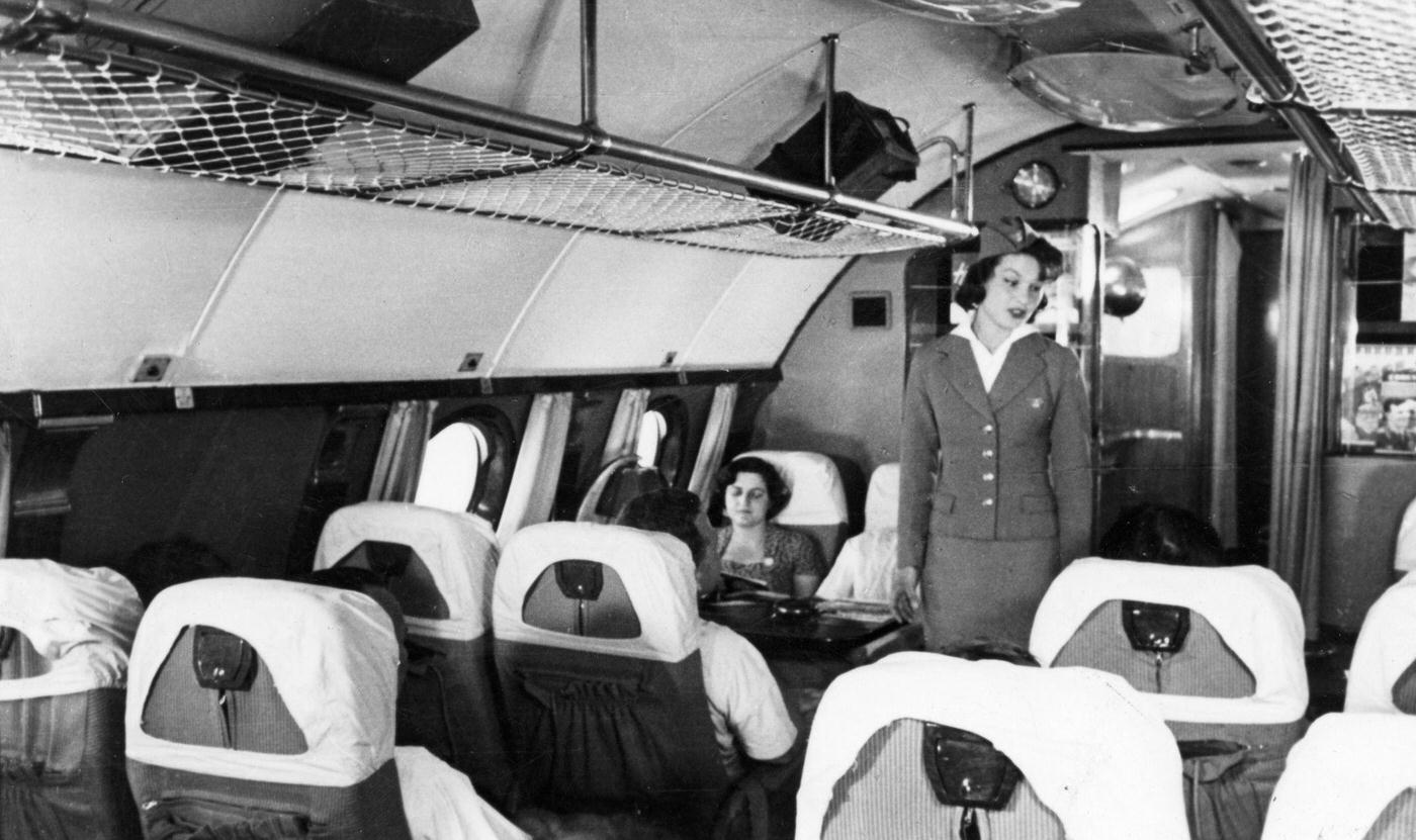 Passengers and a stewardess are pictured aboard a TU114 airliner, which was the world’s largest at the time, in 1959.