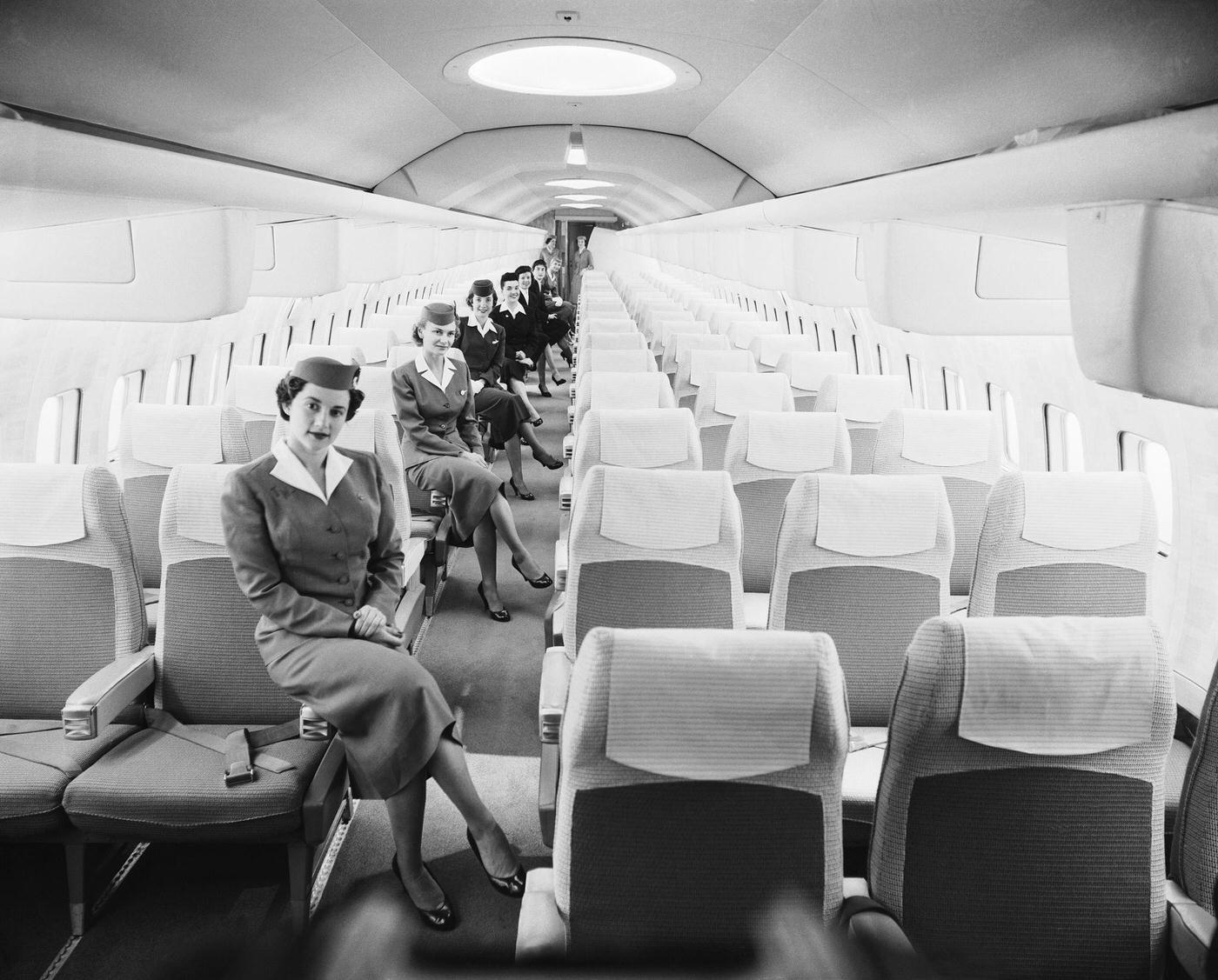 #72 A group of airline stewardesses pose inside the luxurious mockup of the Boeing Jet Stratoliner, which will enter service with airlines worldwide in 1959.
