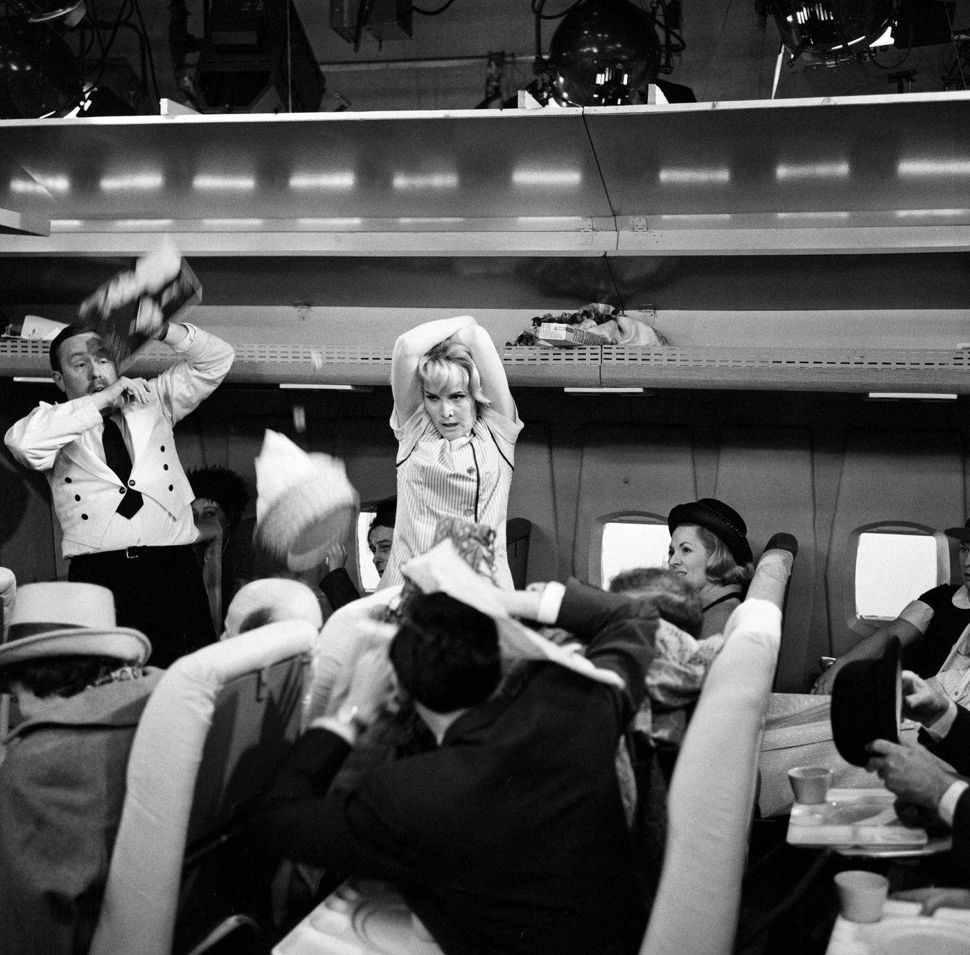 Sheila Hancock playing the role of an air hostess in scenes being shot for the comedy series “The Bed-Sit Girl” at BBC Studios on February 21, 1965.