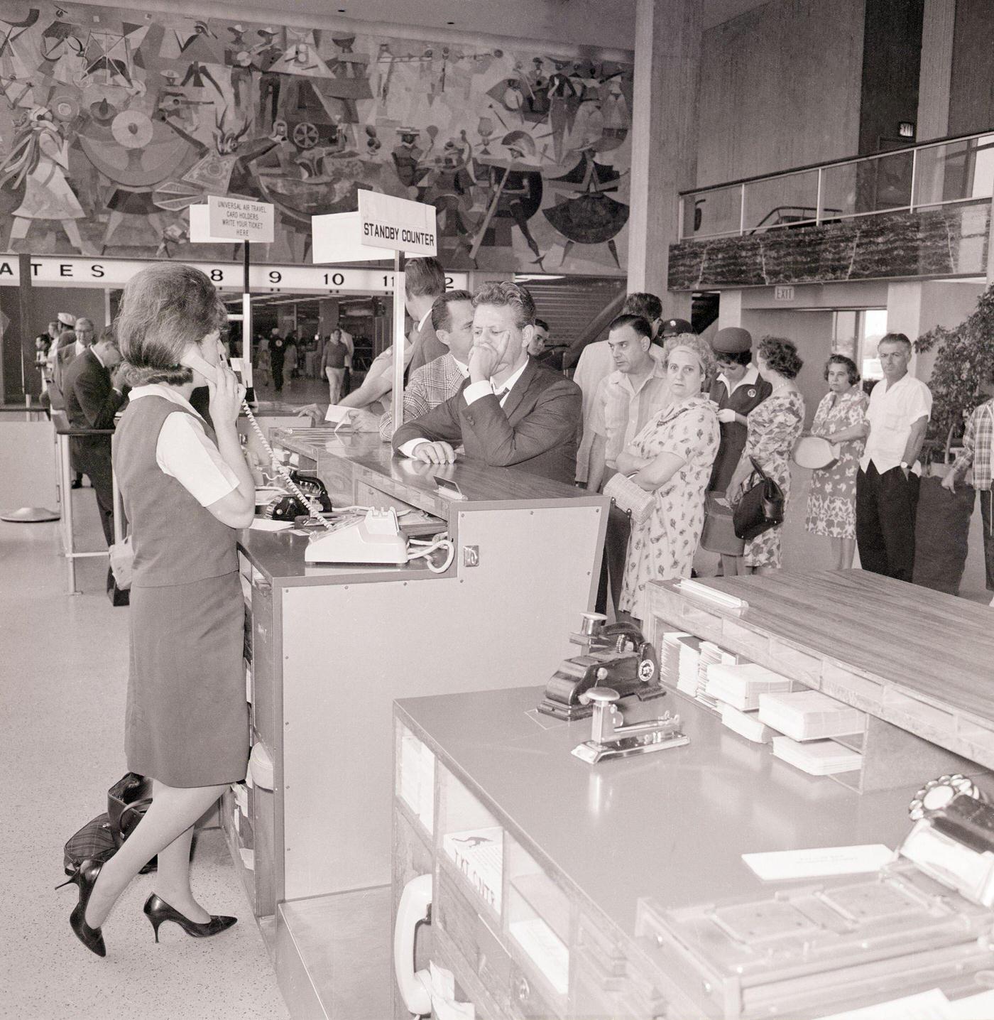 Passengers waiting in line at American Airlines counter at John F. Kennedy International Airport during a machinists’ strike. July 8, 1966.