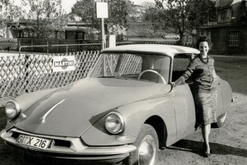 #33 Young lady with Citroën DS in Gießen, West Germany registration, 1960