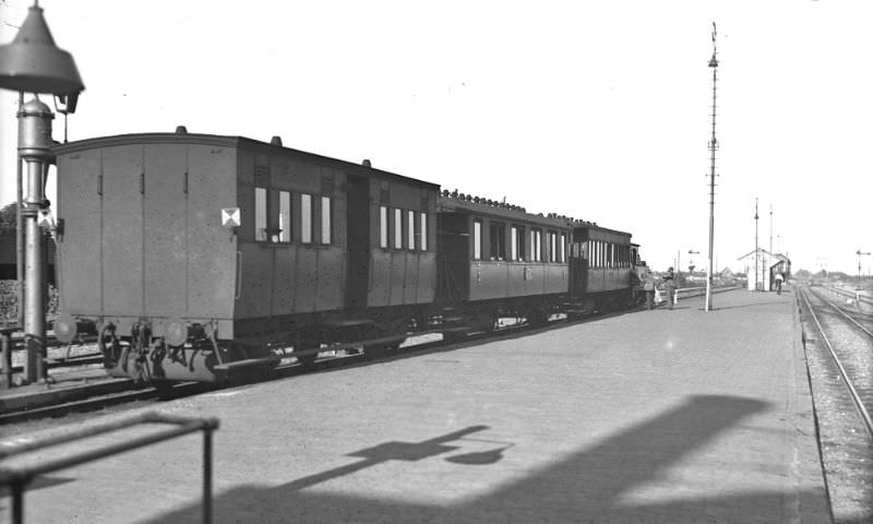 #16 Train with no fewer than three carriages ready for departure to the capital. The locomotive personnel have arrived at their machine packed and ready to go, Aalsmeer, circa 1950