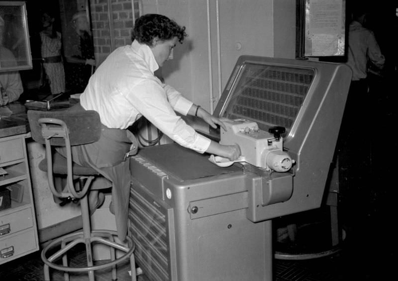 #30 AEG ticket printer at the counter of Amsterdam Centraal Station, July 1956