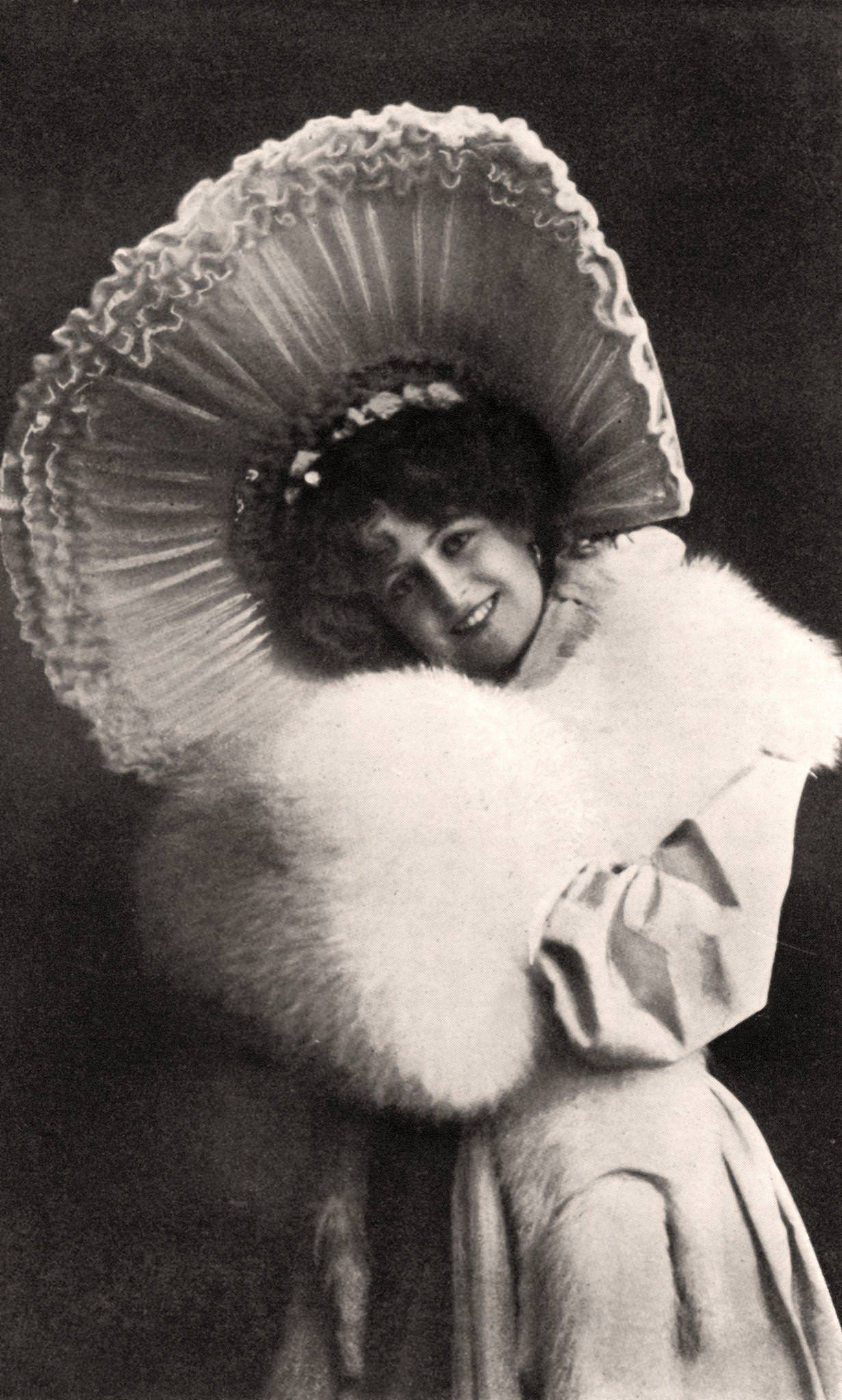 #26 Marie Studholme looks stunning in her fashionable hat and attire
