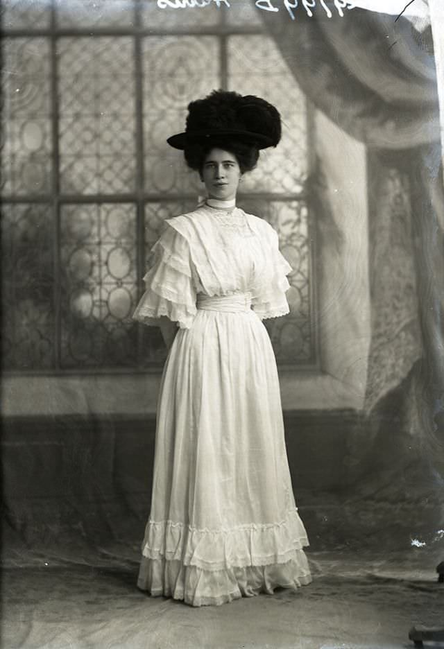 #113 Miss E Harris poses for a portrait in 1908