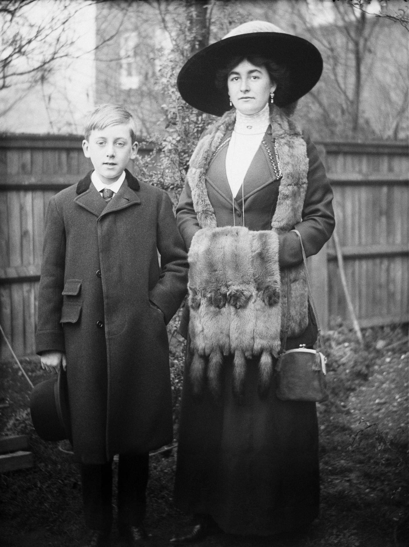 #27 Joan Mainwaring and a young boy enjoy a playful moment in a backyard, 2nd November 1912