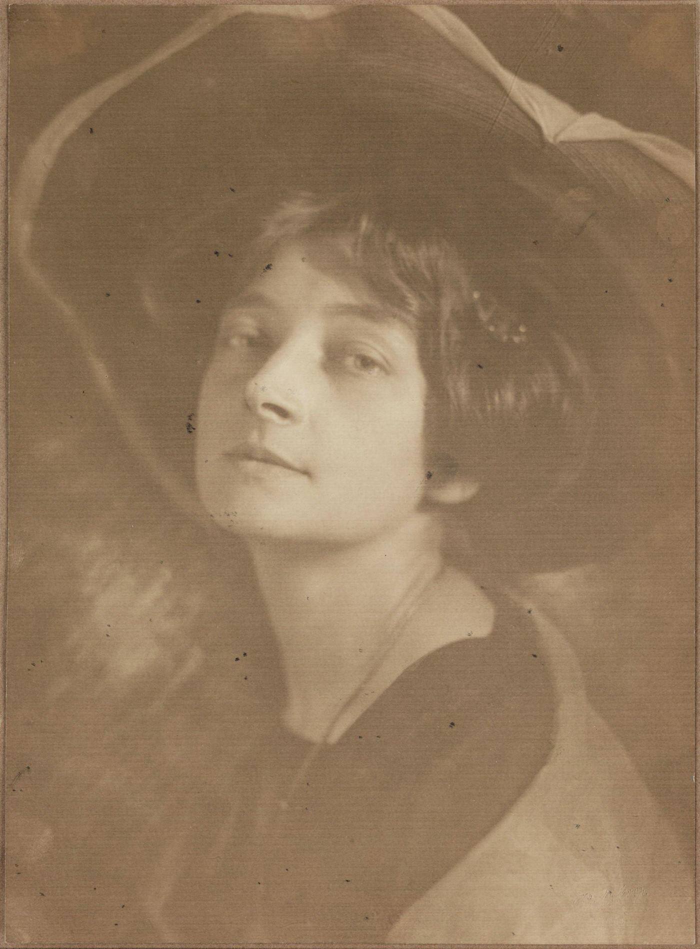 #35 An Edwardian lady radiates beauty and grace in her fashionable hat