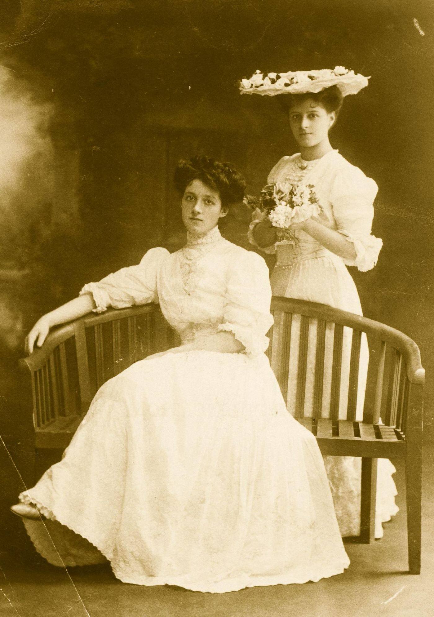 #50 Two Edwardian ladies enjoy a day out in their summer day dresses