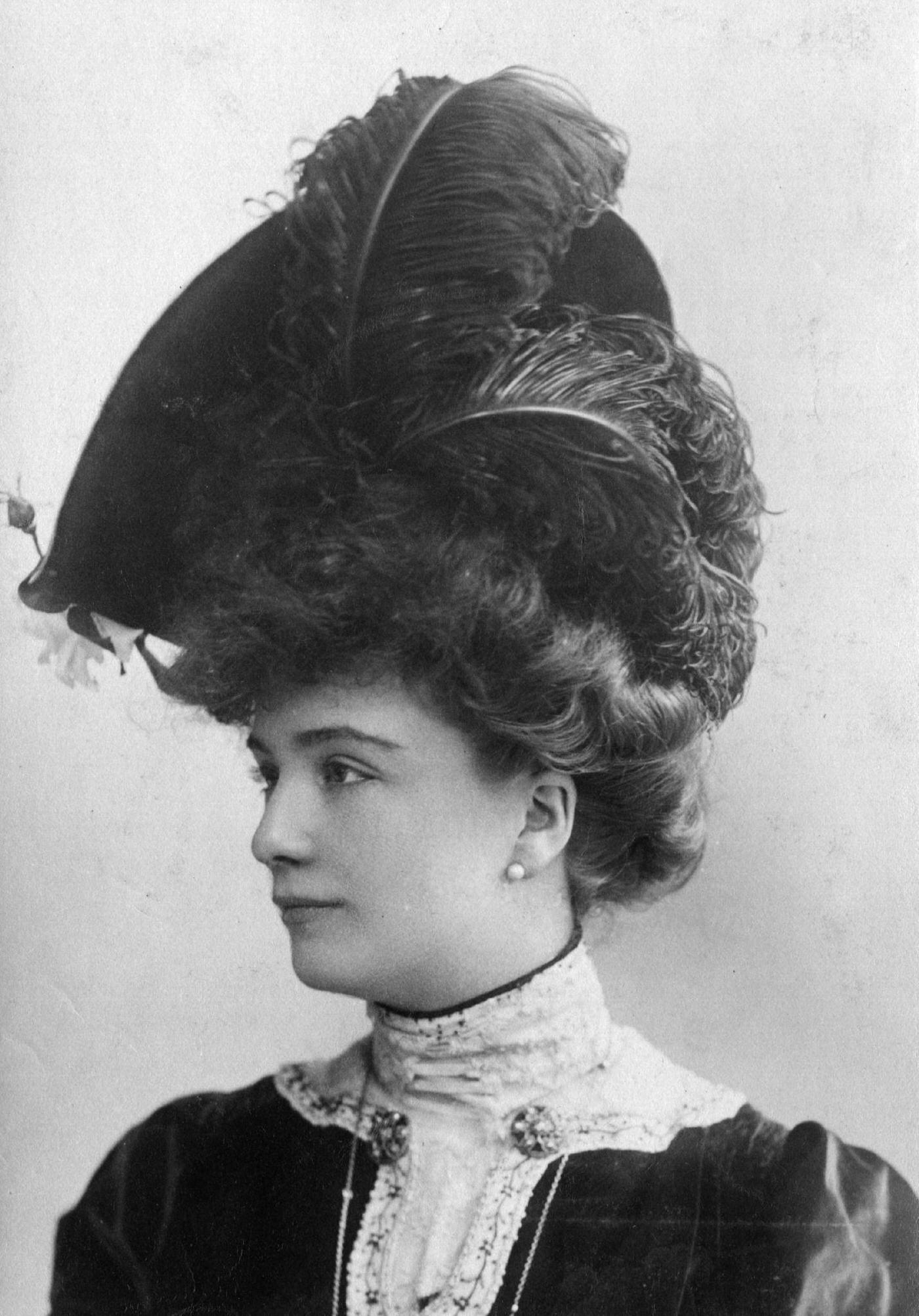 #58 An Edwardian woman looks stunning in an ostrich feather hat in 1903