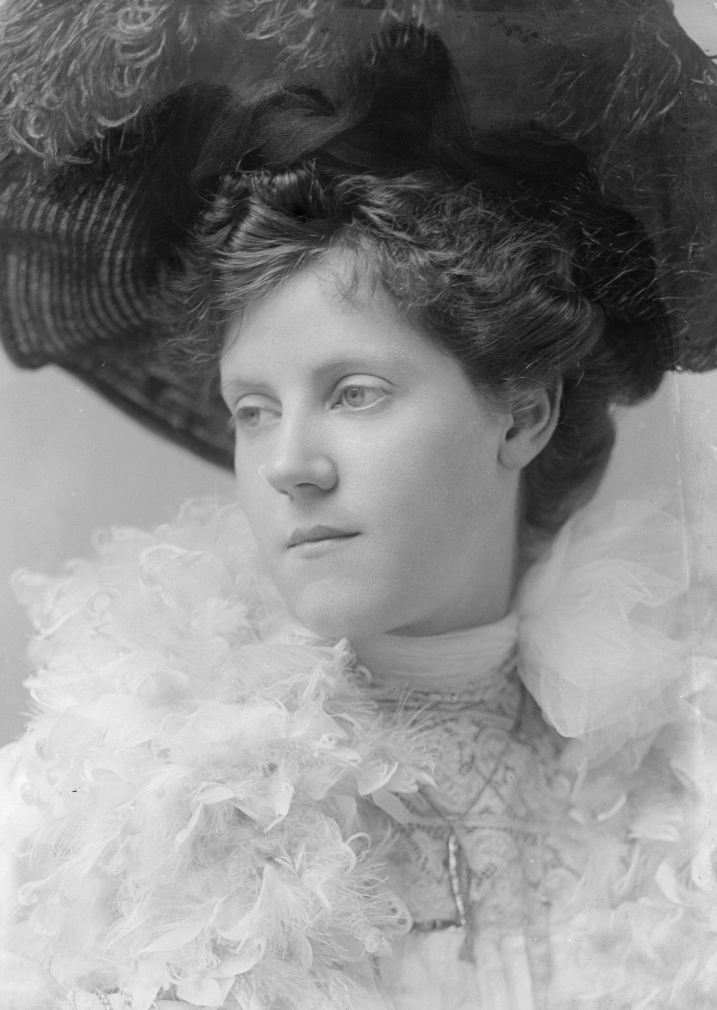 #60 Miss V. Forrestor looks stunning in her feathered hat and boa in 1903