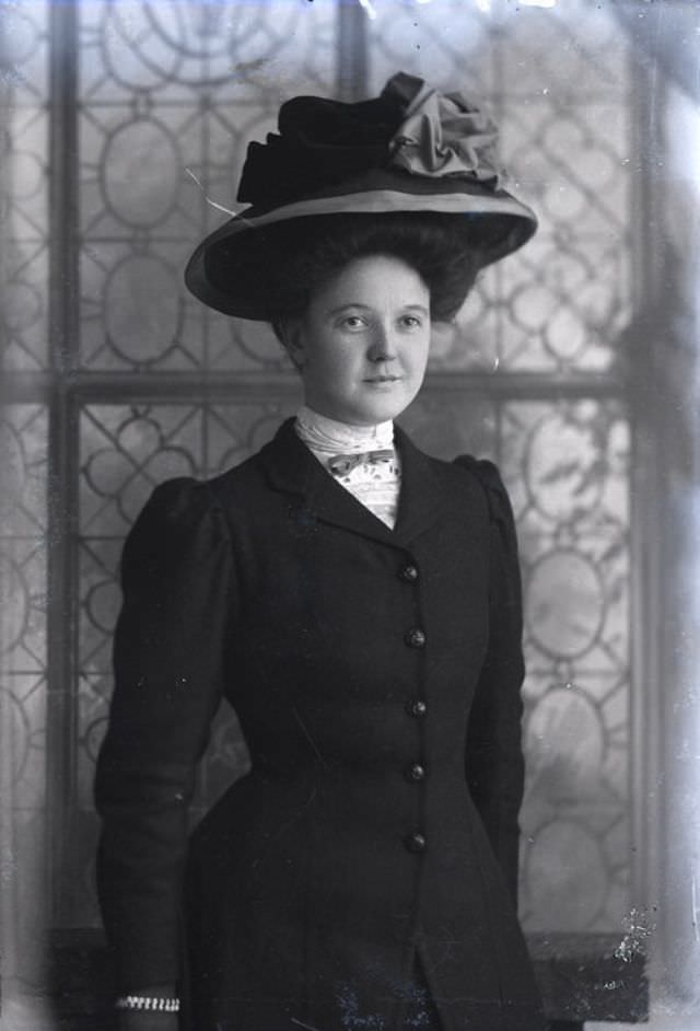 #104 Miss J Scott poses for a portrait on December 30, 1907
