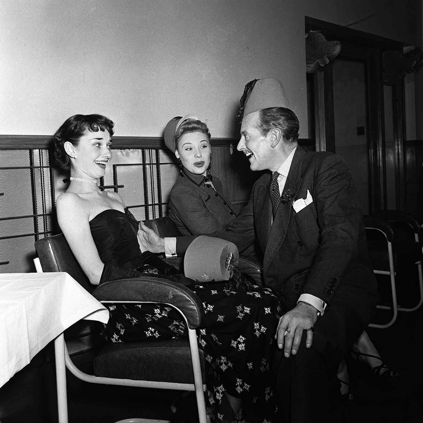 #18 Enjoying the festivities are British actresses Audrey Hepburn (left) and Sandra Dorne, and actor Guy Middleton.