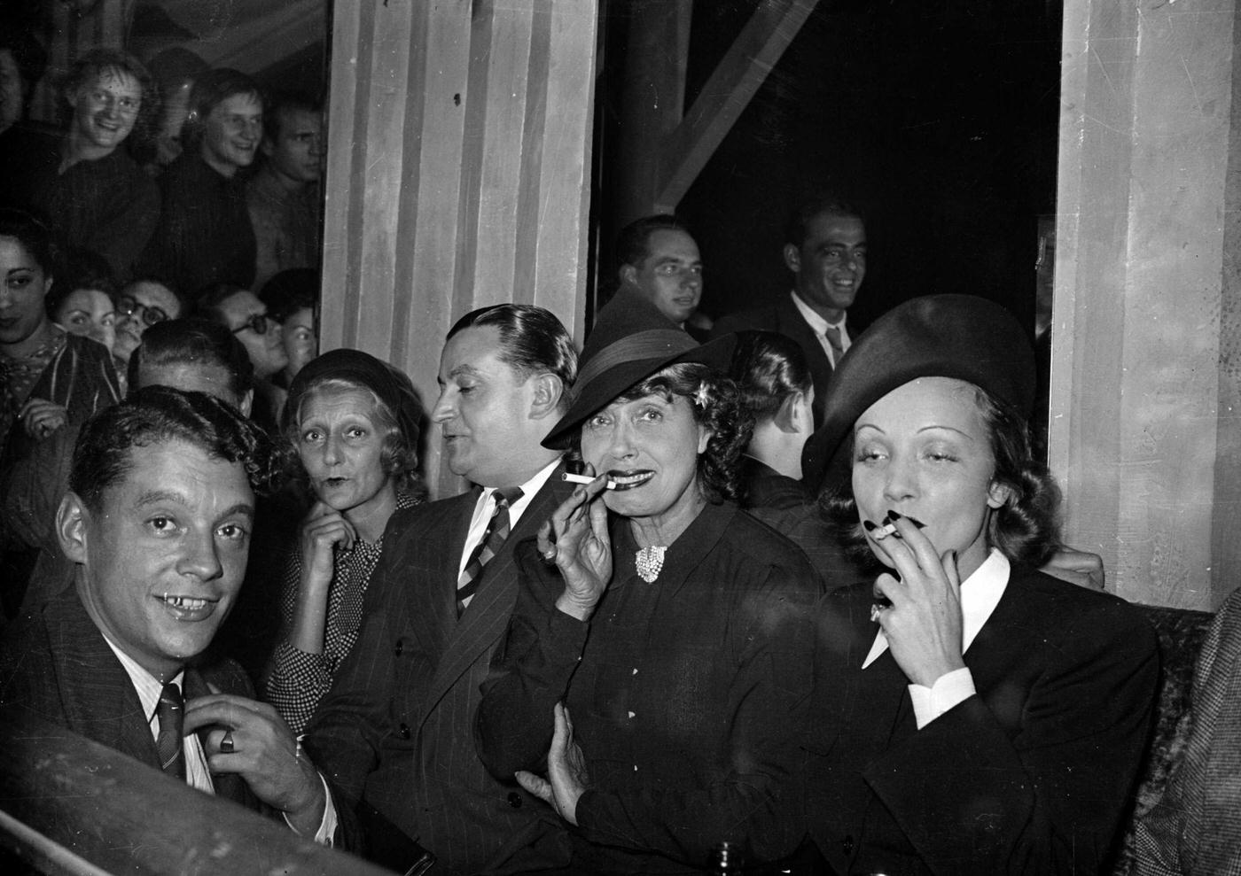#45 In the 1930s, Mistinguett and Marlene Dietrich are seen smoking together.