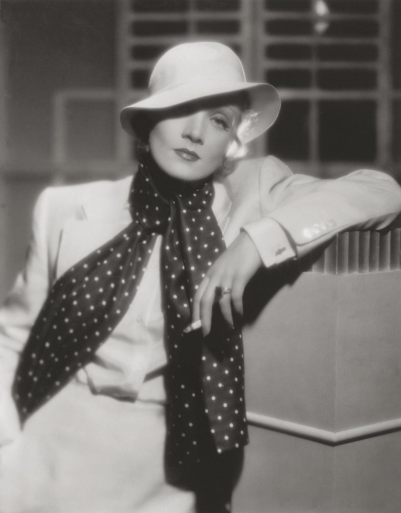 #58 A photograph of Marlene Dietrich smoking taken in 1934.