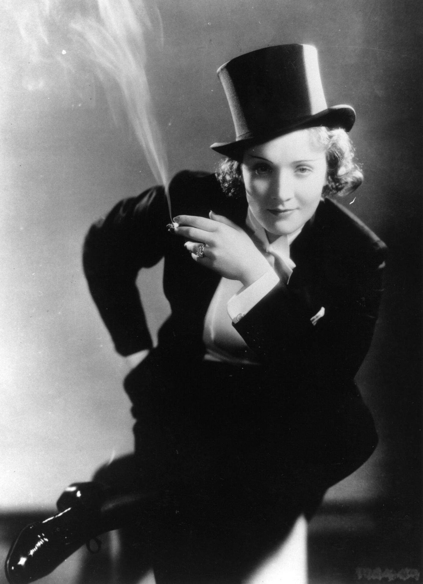 #46 Marlene Dietrich looks dapper in men’s top hat and tails in the film ‘Morocco.’