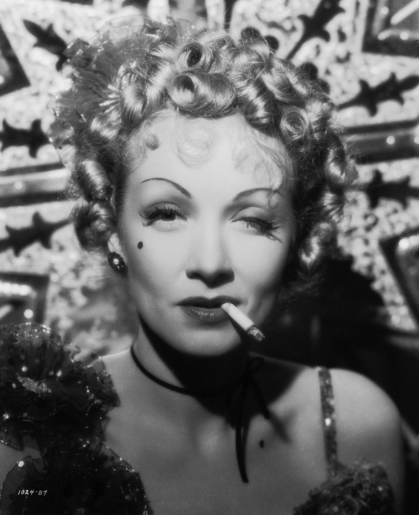 #21 Marlene Dietrich plays Frenchy in a scene from the 1937 film ‘Destry Rides Again.’