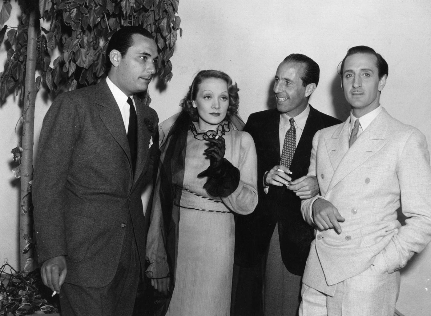 #23 Basil Rathbone meets fellow film star Marlene Dietrich.