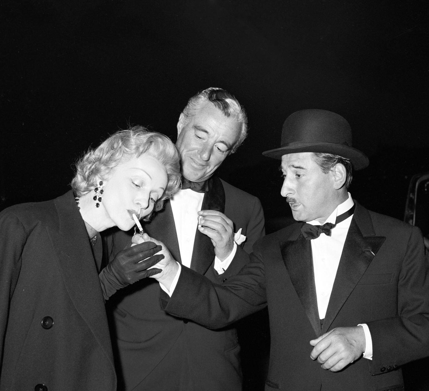 #40 Renato Rascel, Vittorio De Sica, and Marlene Dietrich are pictured on the set of ‘The Monte Carlo Story.’