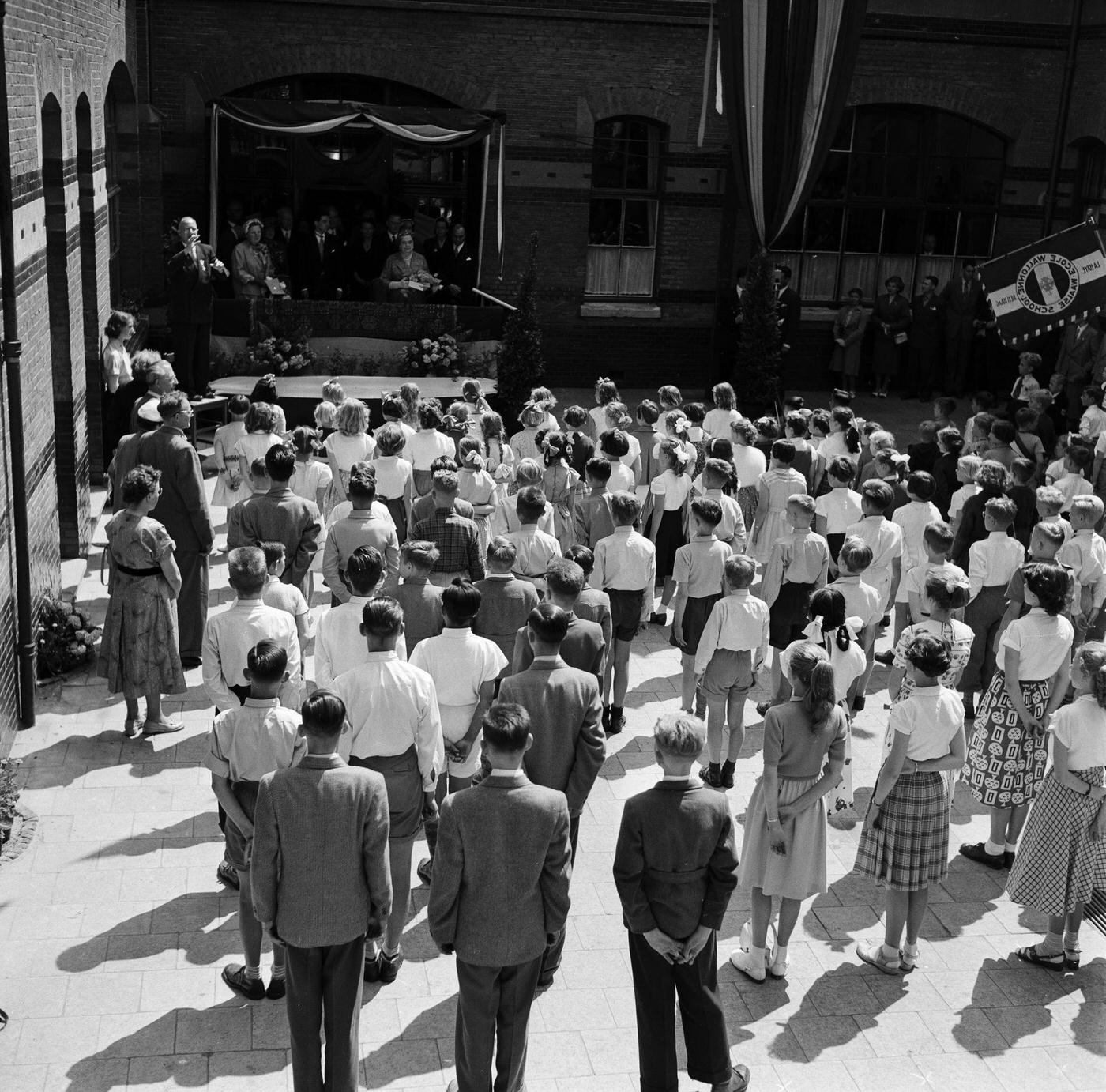 #22 René Coty in Holland, 3rd March 1955. The President of the French Republic, René Coty and his wife, on a visit to Holland. Mrs Coty is seen on a balcony in front of children lined up in a courtyard.