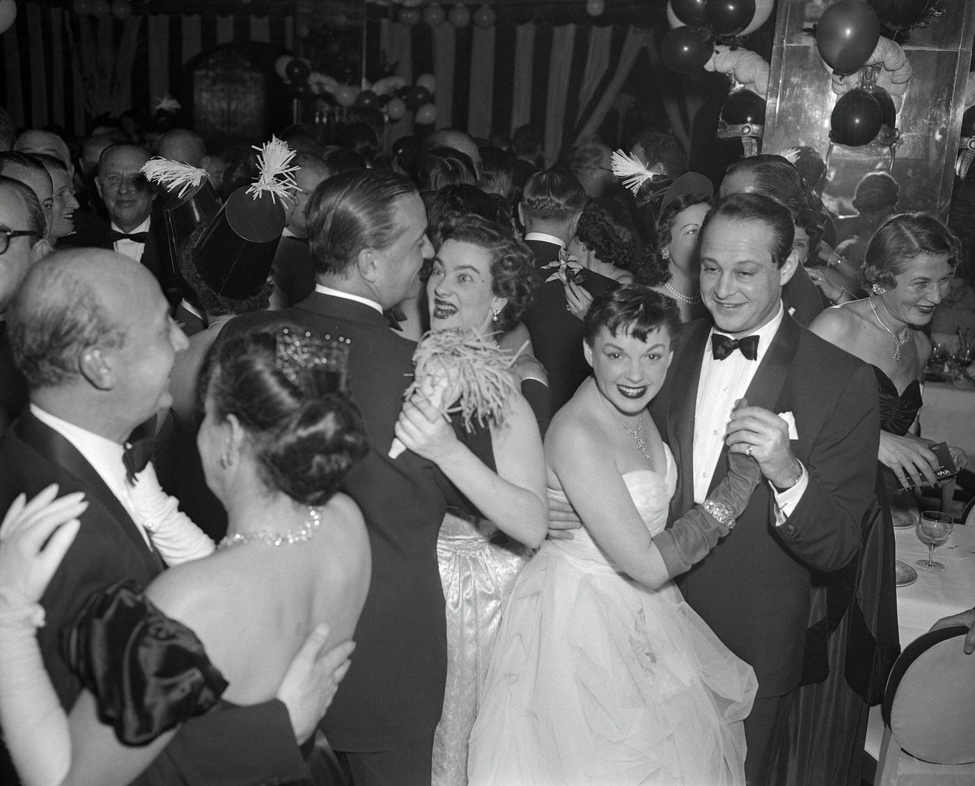 #40 Judy Garland is shown here dancing with Sidney Luft at the Sherry Netherlands Hotel.